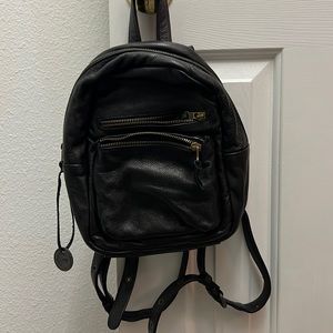 Black leather small backpack purse Wanders Travel Co.